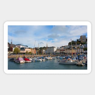 A sunny view across the boats moored in the harbour of the Devonshire seaside town of Torquay. Sticker